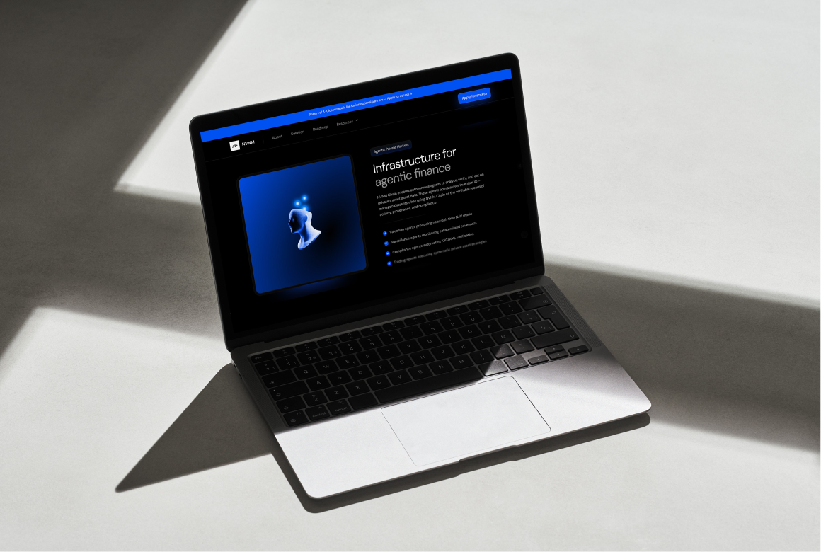 Person sitting on floor working on laptop